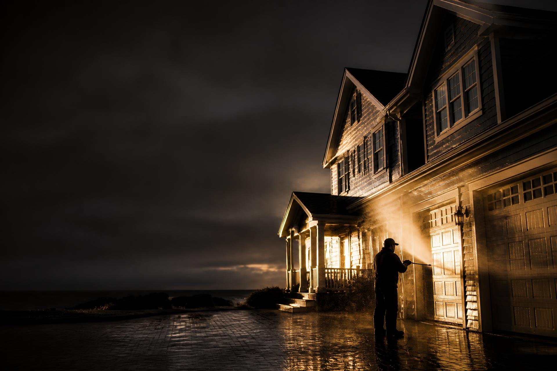 Exterior house washing on a South Coast home at dusk